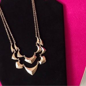 Two layer gold-tone necklace.